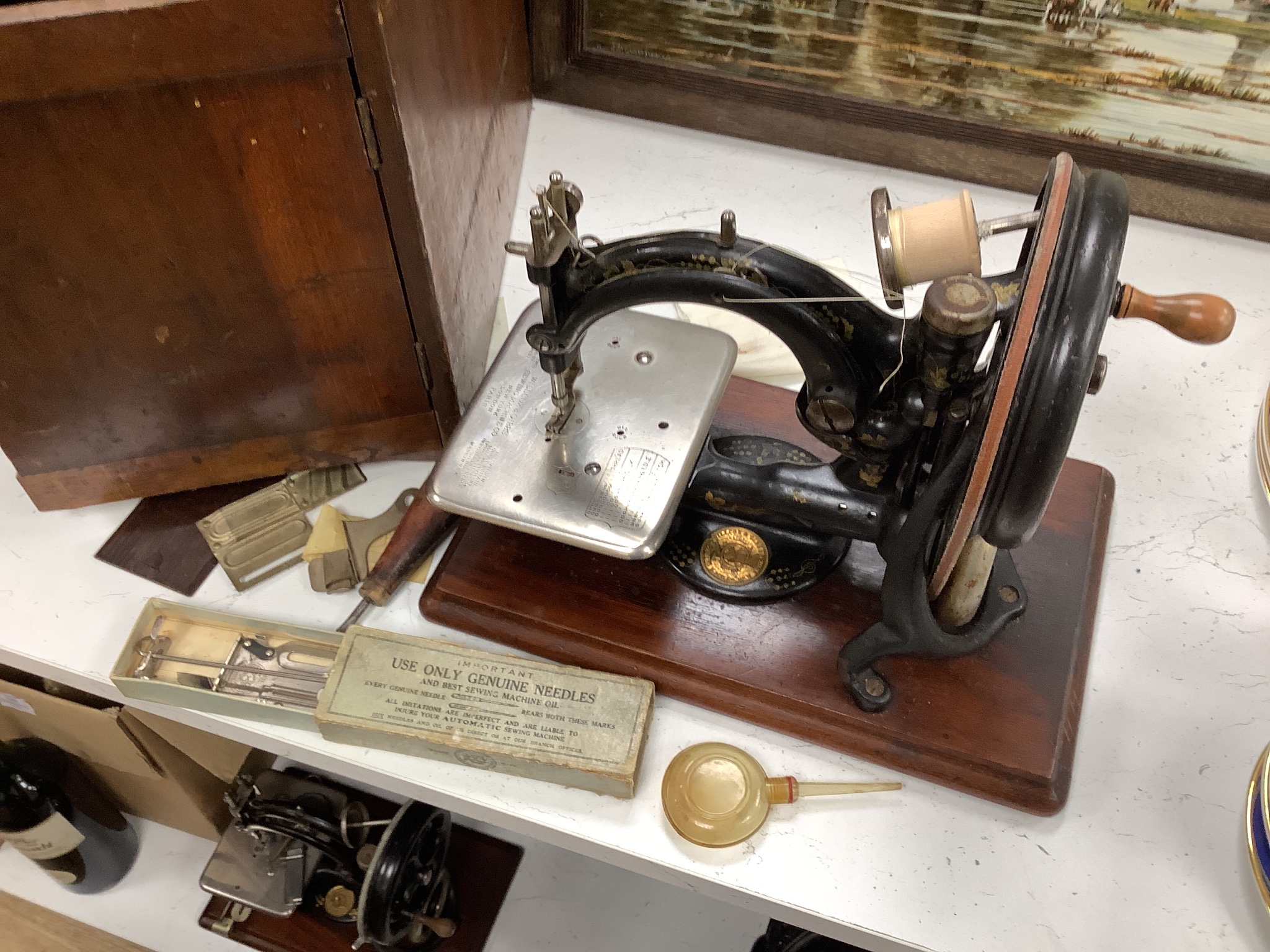 Two cased vintage portable sewing machines, Willcox and Gibbs, 32cms wide